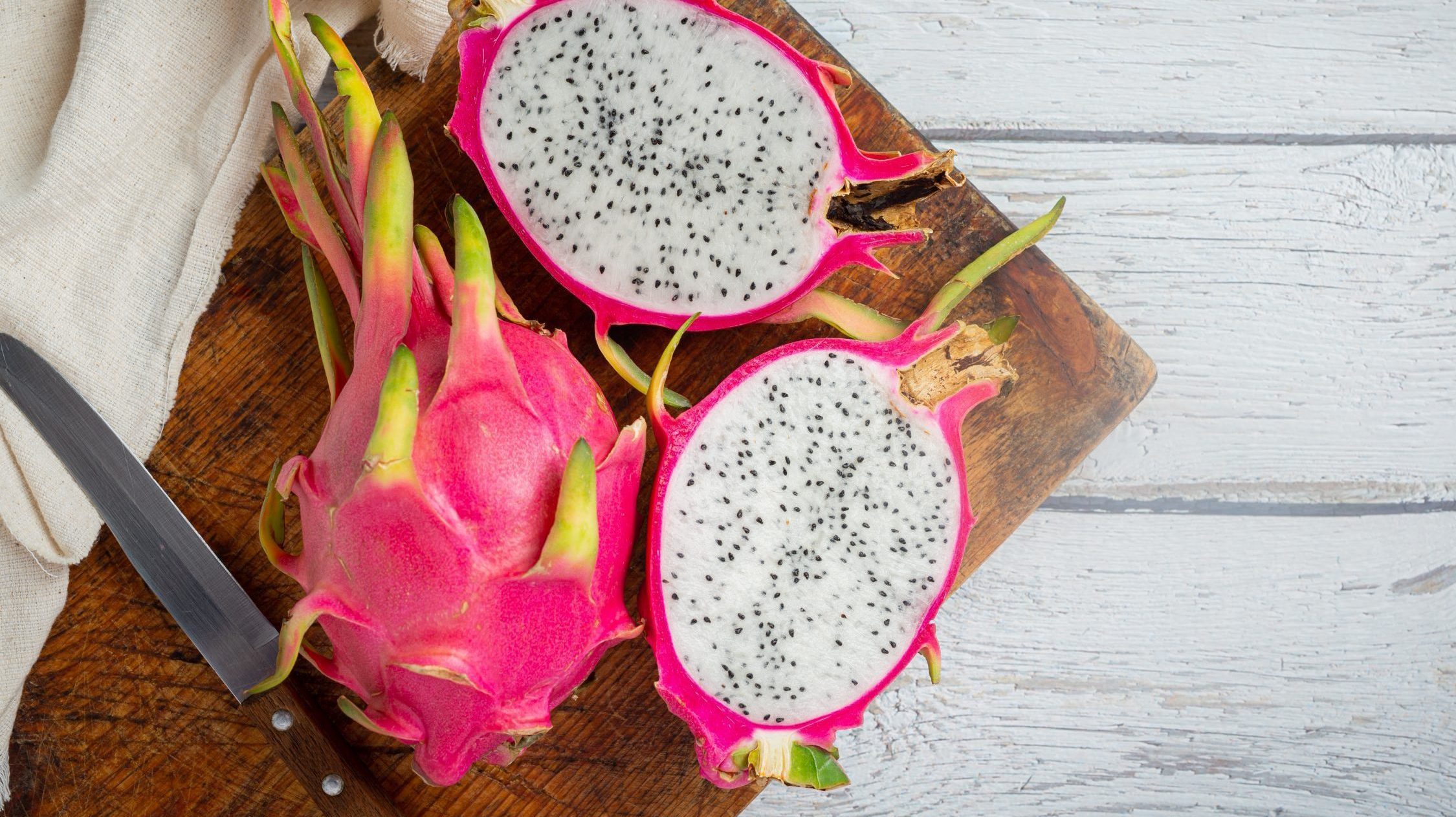Dragon fruit on old wood background