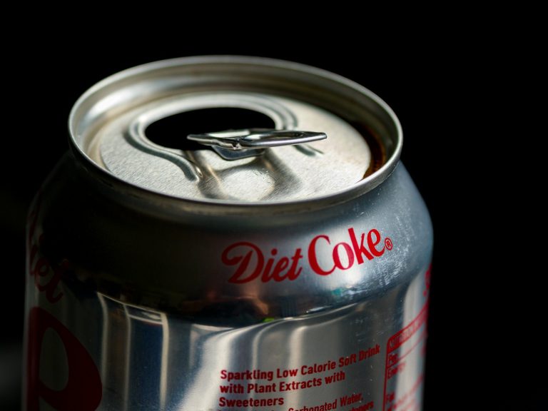 a can of diet coke sitting on a table