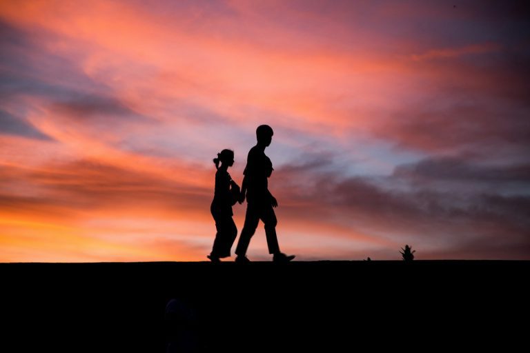 silhouette photography of man and woman