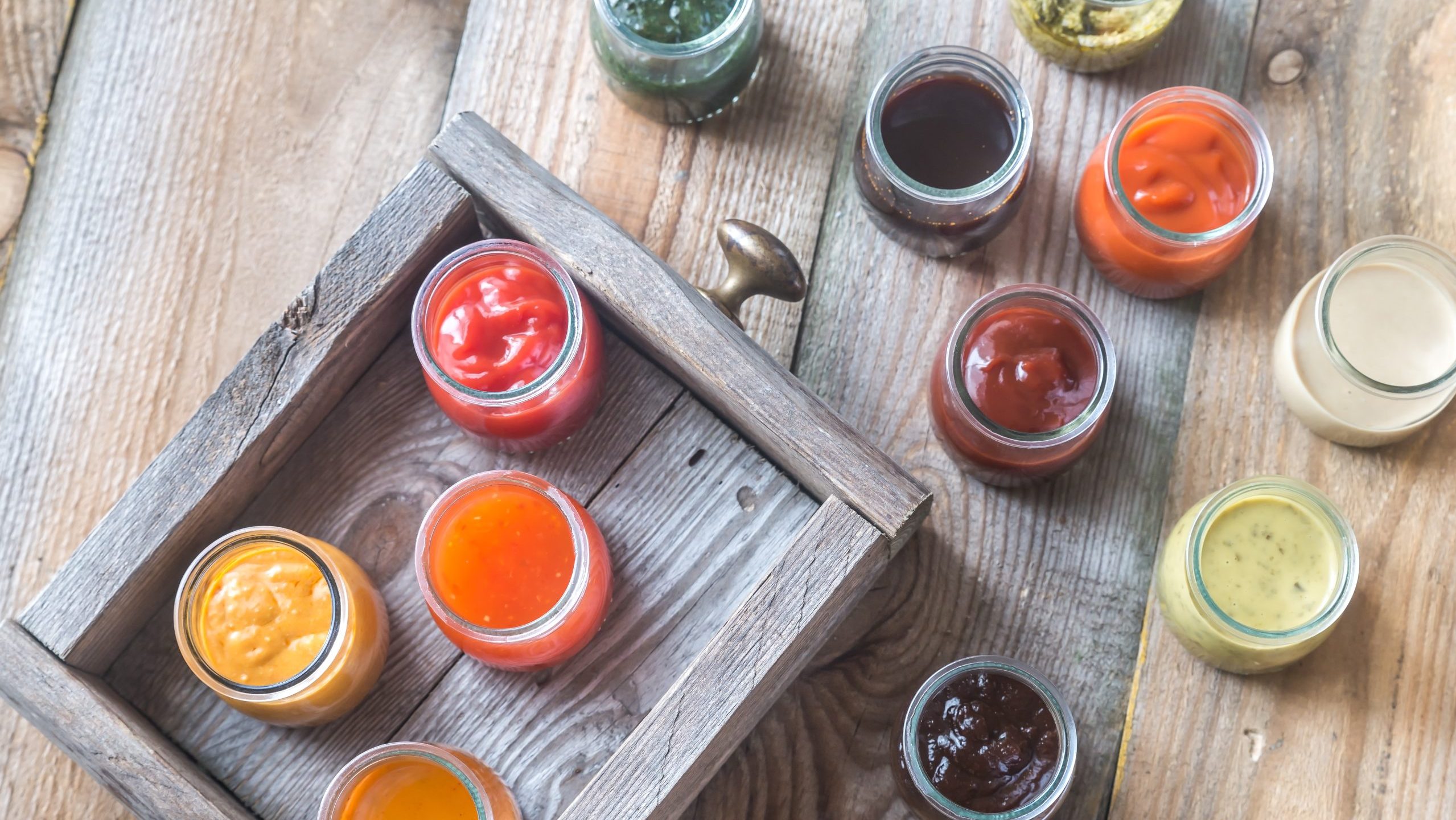 assorted sauces and dressings in jars