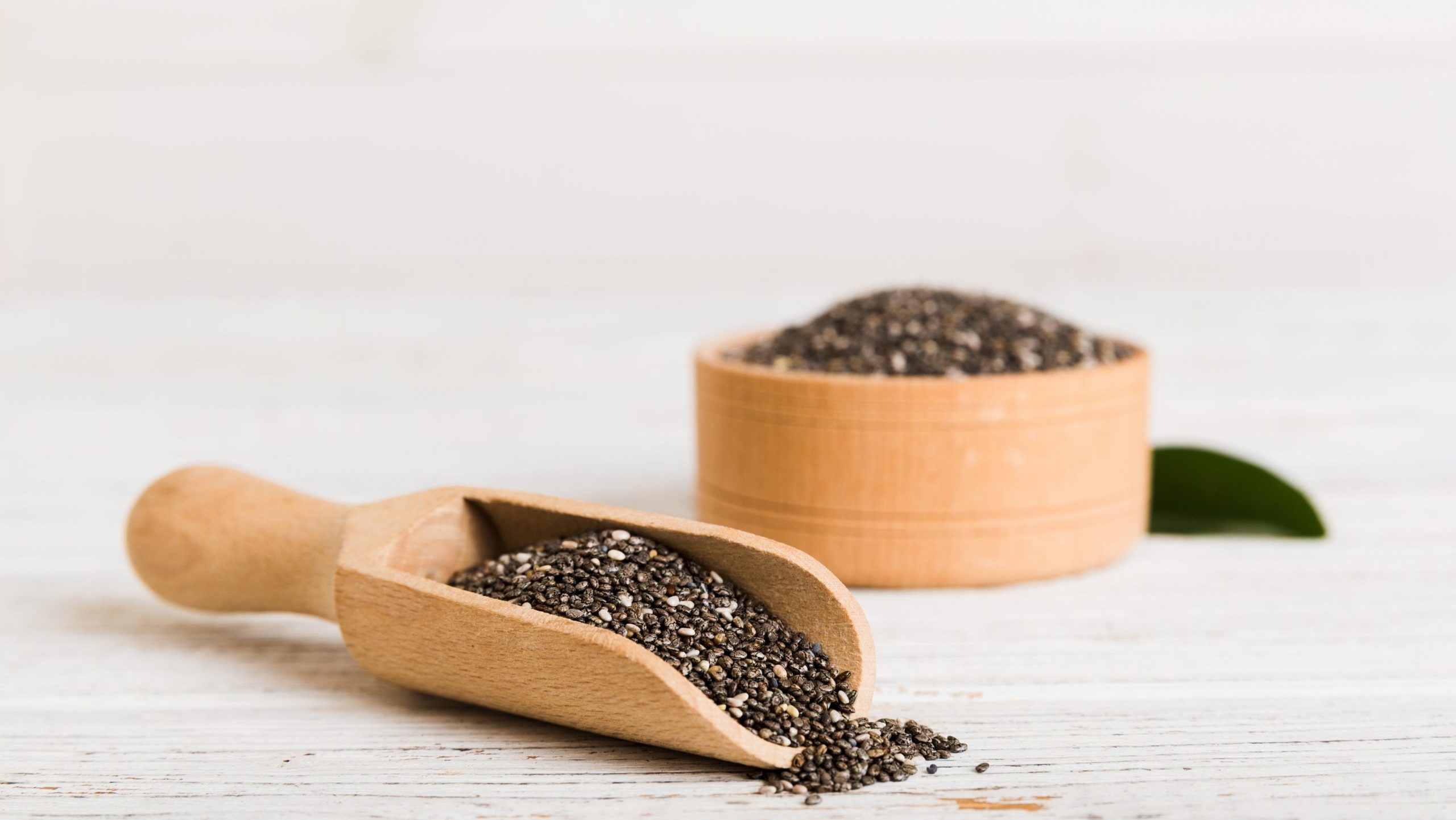 FOOD HEALTH Chia Seeds VEGETABLE FRUIT Chia,Seeds,In,Bowl,And,Spoon,On,Colored,Background.,Healthy