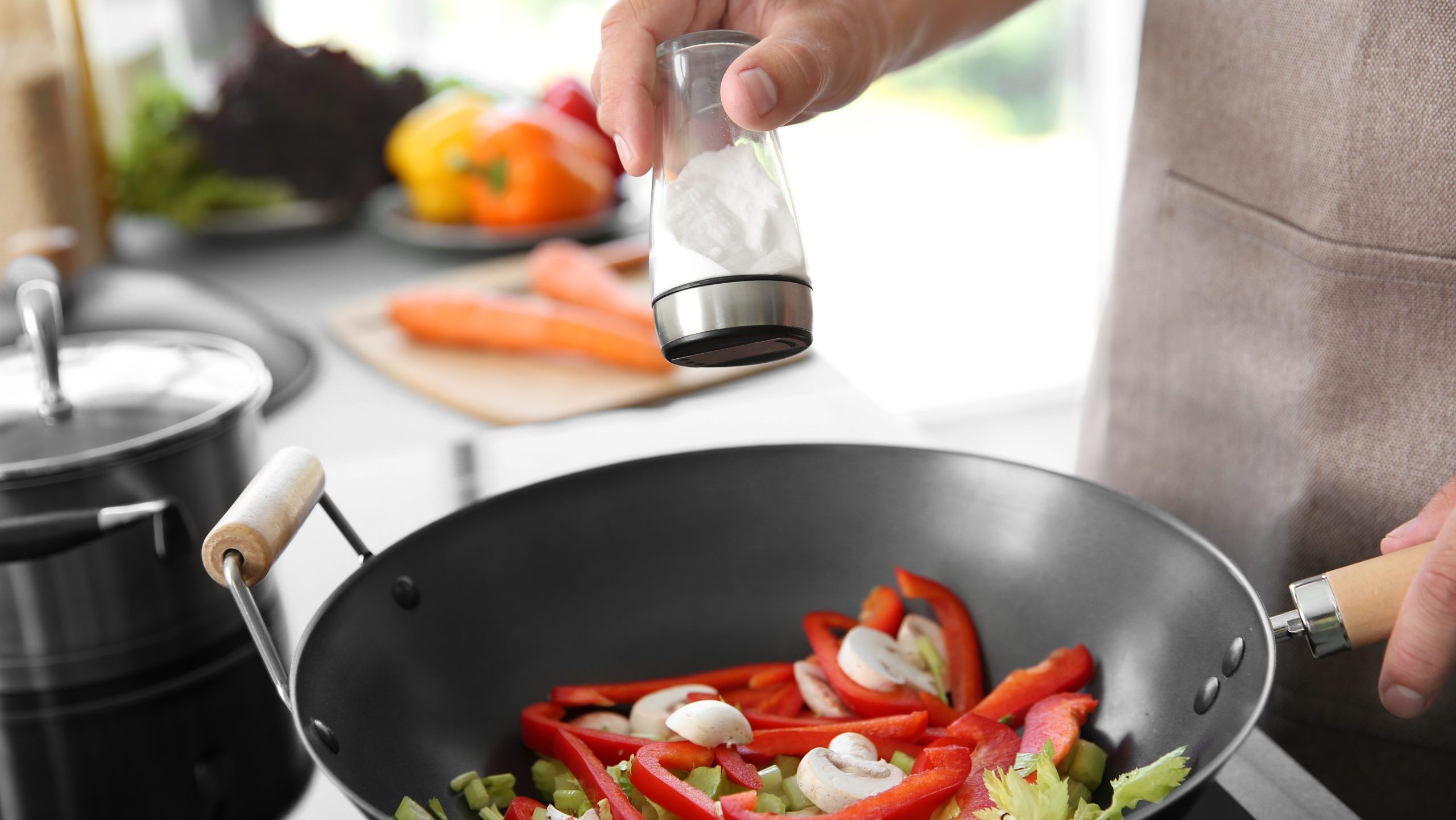 adding salt and pepper to food