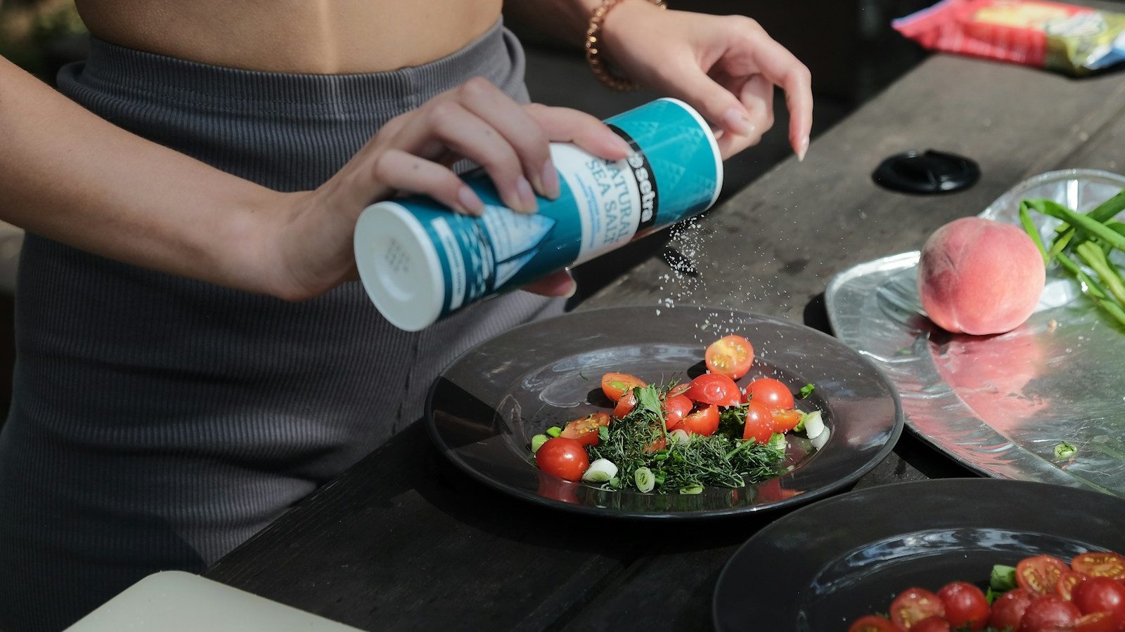 woman holding blue and white labeled can