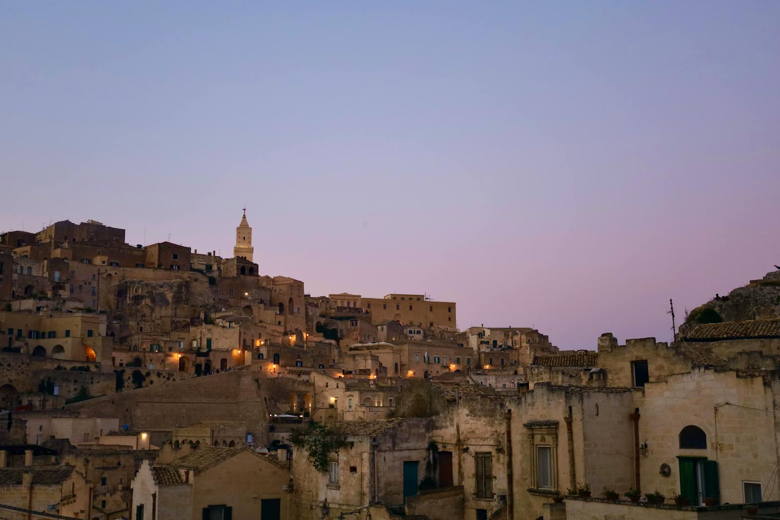 Discover the enchanting twilight view over the historic cityscape of Matera, Italy.