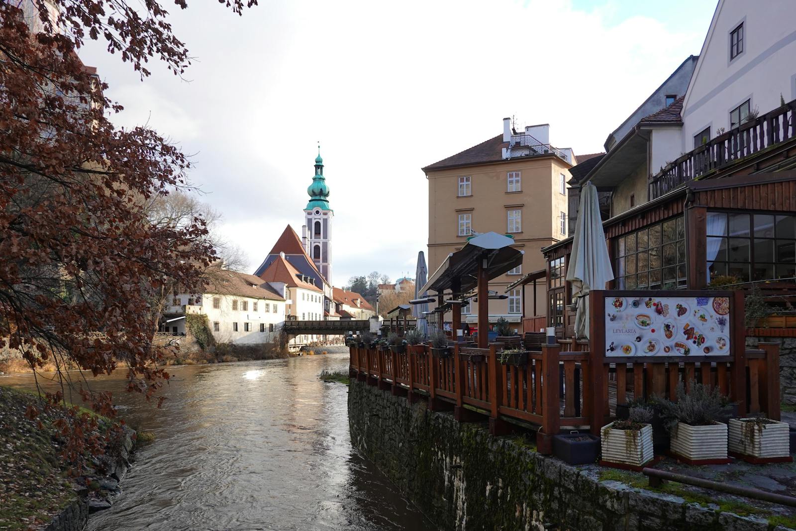 Picturesque scene of Český Krumlov showing St. Jost Church and Vltava River.