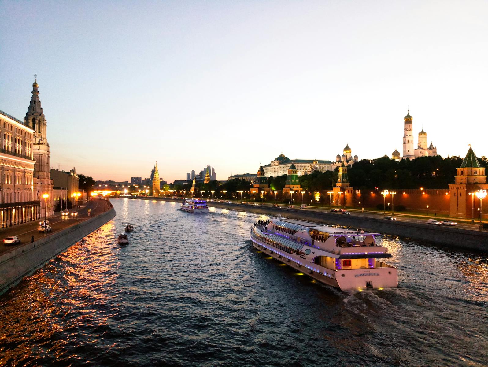 Explore Moscow's iconic skyline during a scenic evening river cruise, featuring the Kremlin's grandeur.