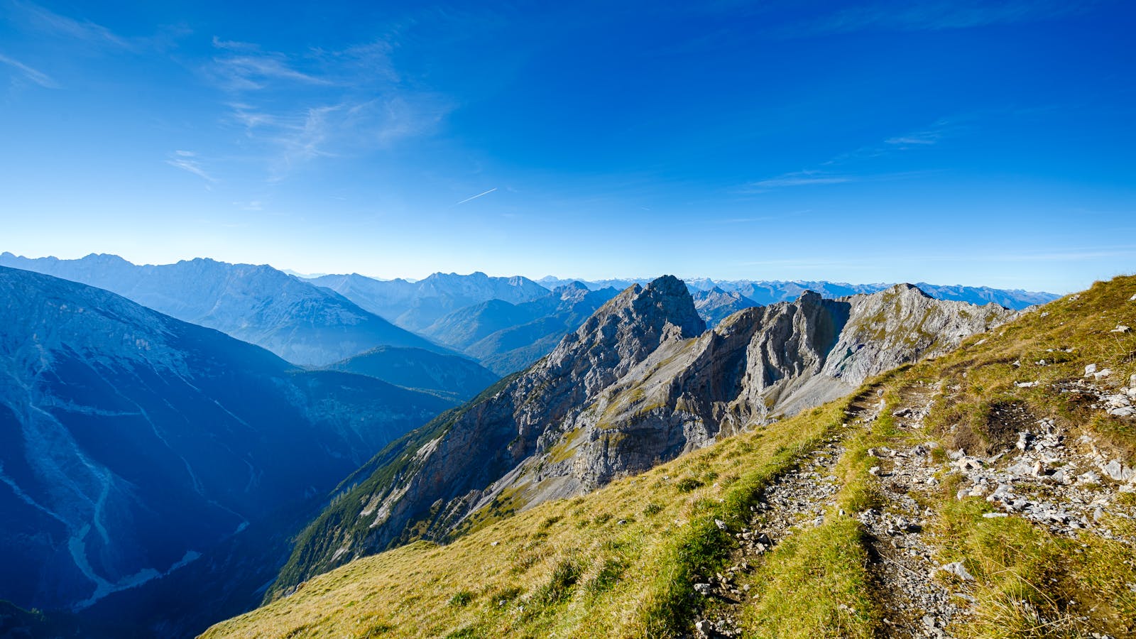 Stunning landscape of the rocky mountains with a vibrant blue sky in Mittenwald, Germany.