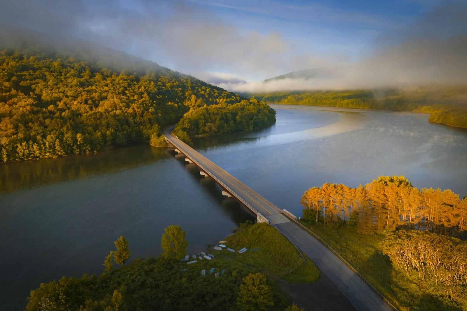 an aerial view of a bridge over a river