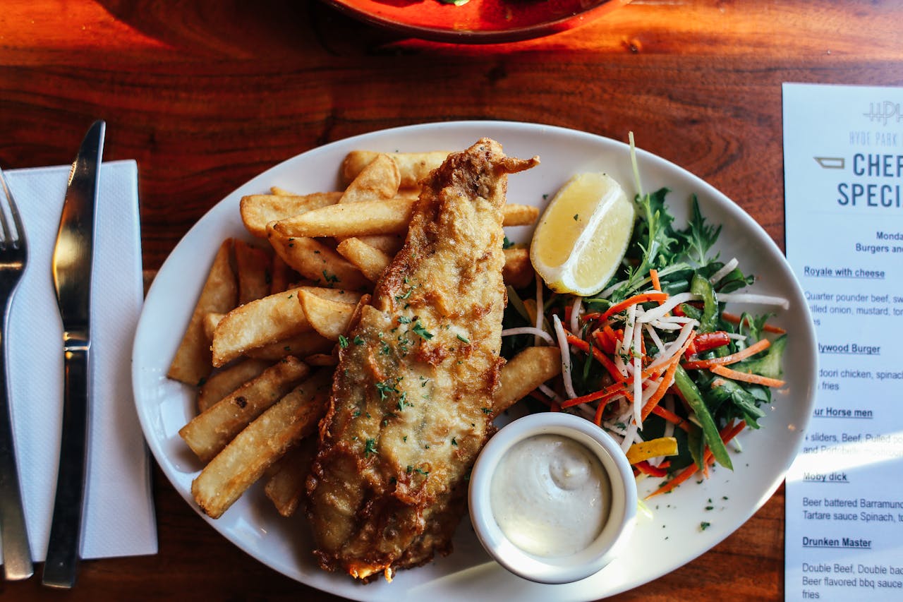 Crispy Fish and Chips Servings on Table