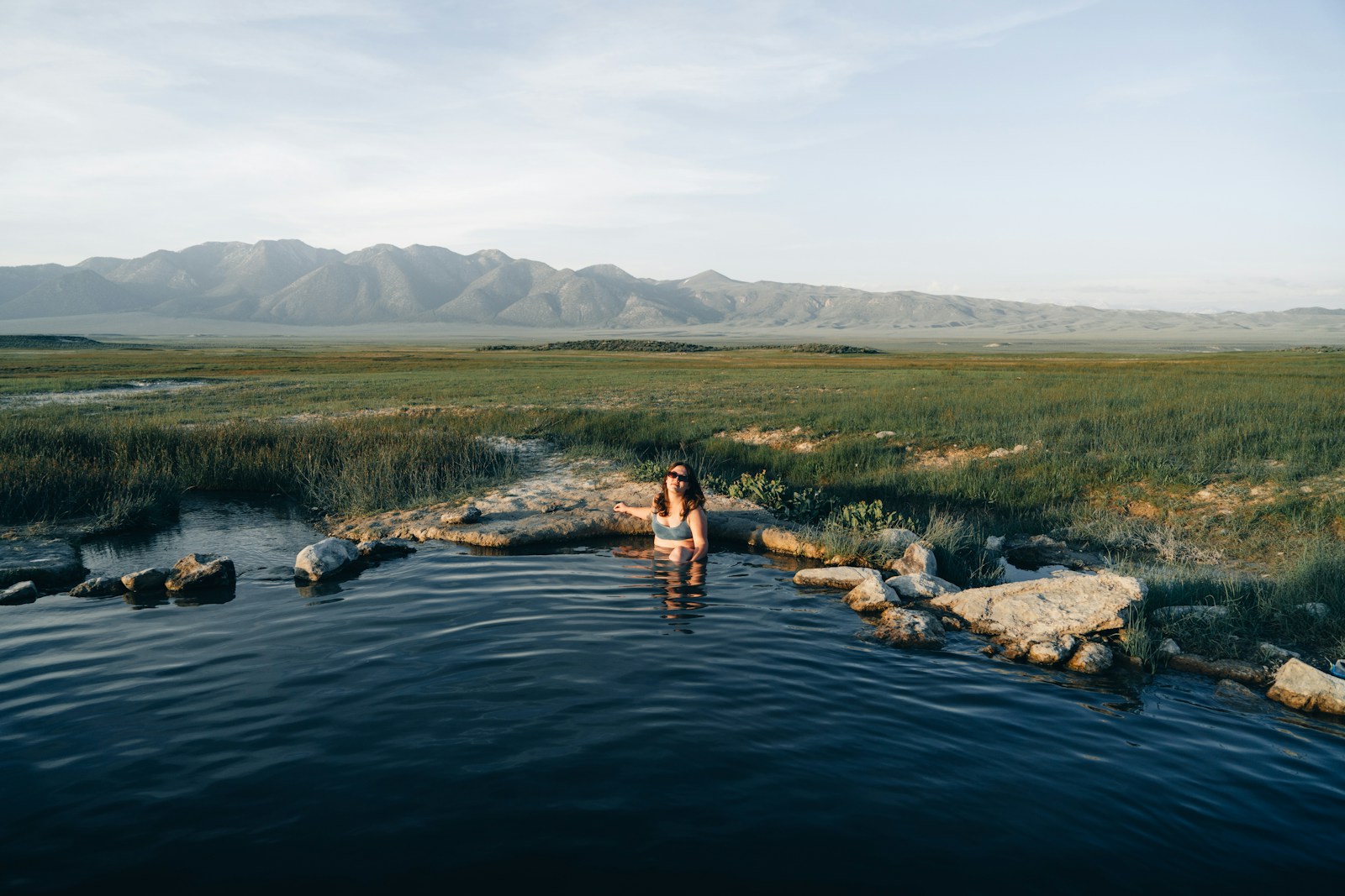 a woman standing in a body of water