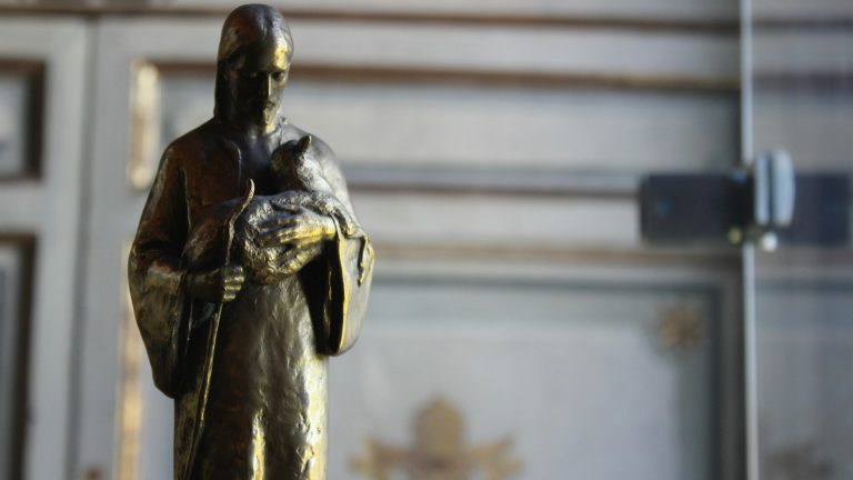 black and gold statue of man