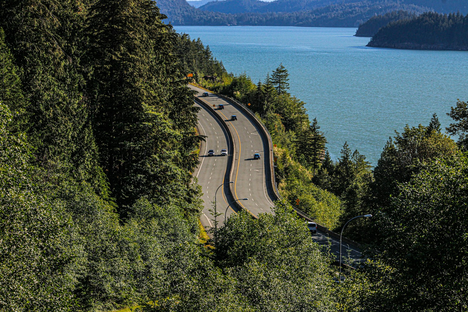 A scenic view of a road near a body of water