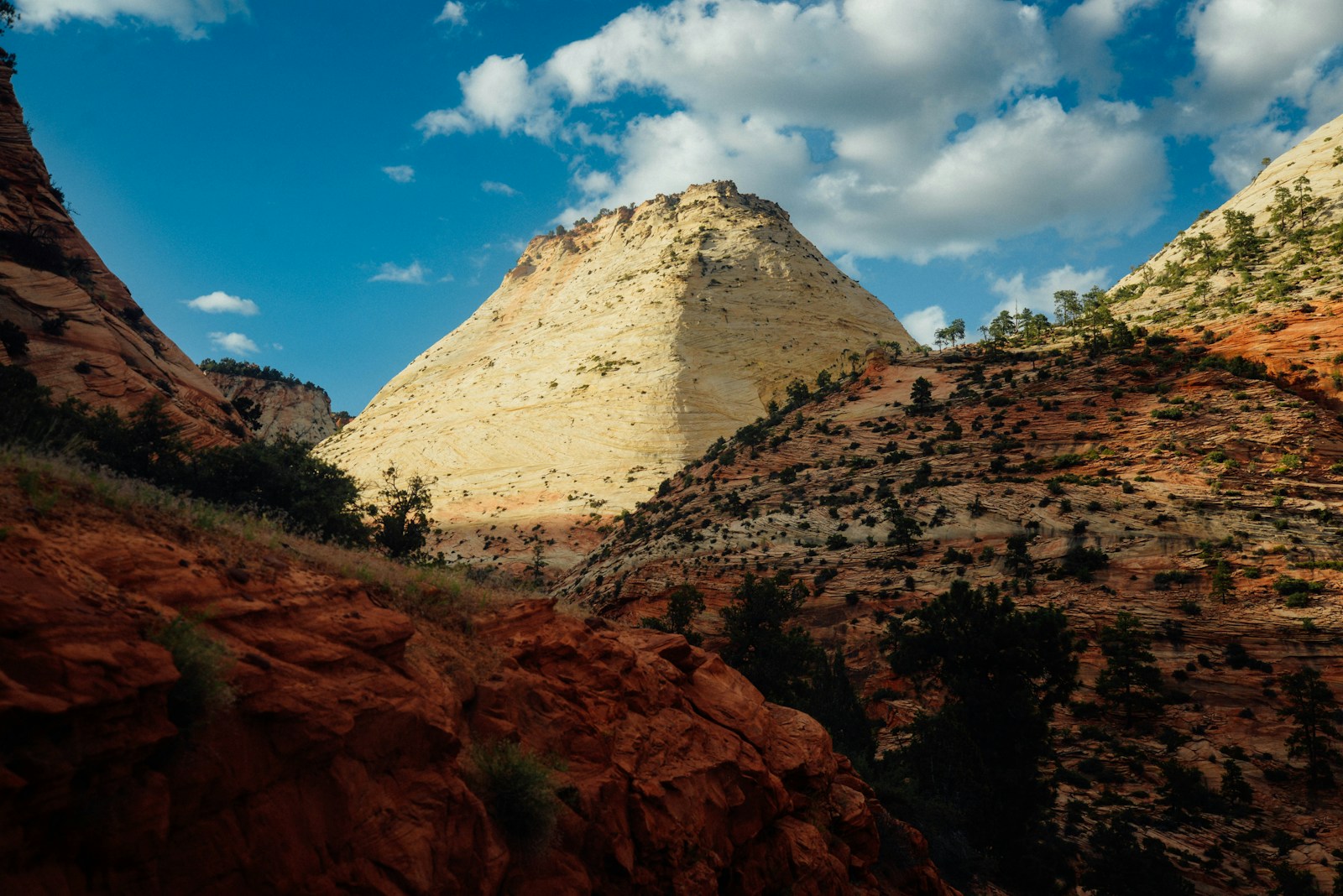 brown rocky mountain under blue sky during daytime