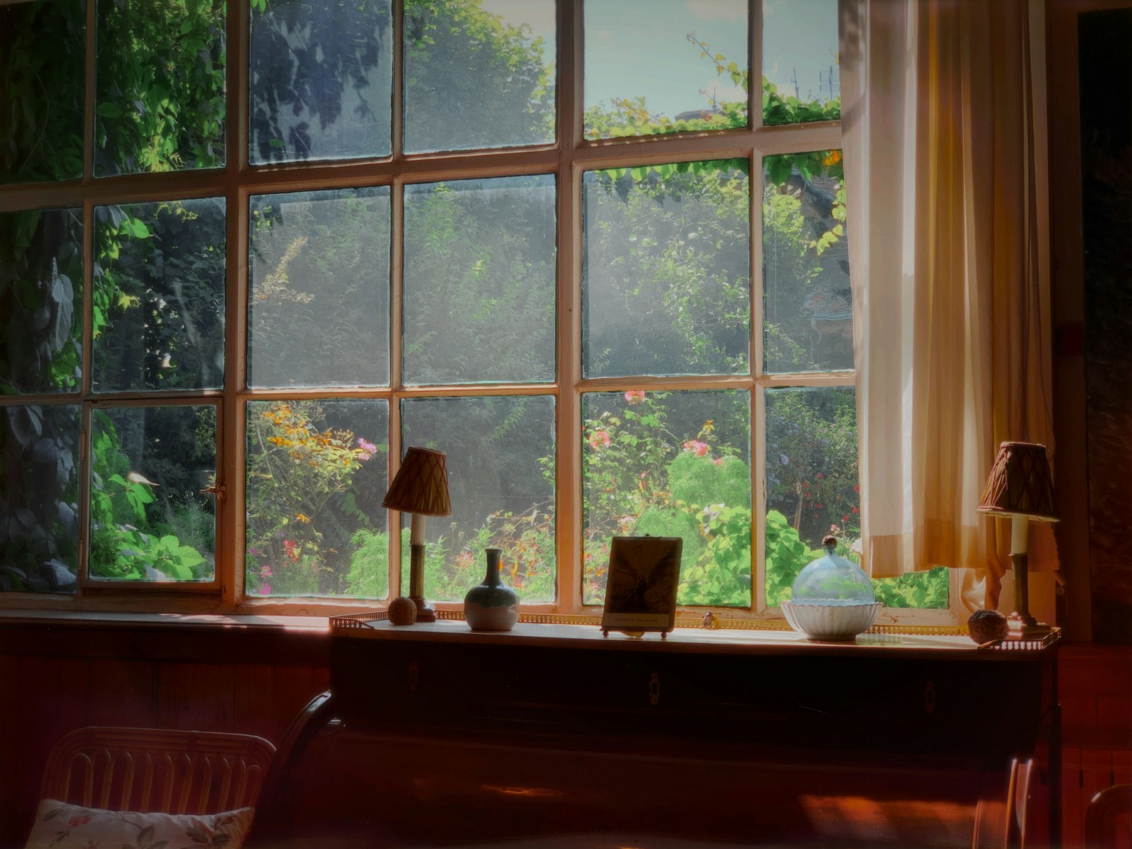 brown wooden desk with table lamps beside window