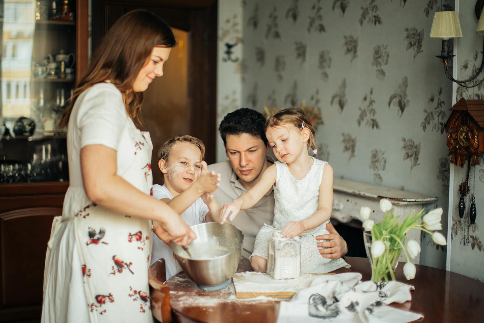A joyful family bakes together in a cozy kitchen setting, creating lasting memories.