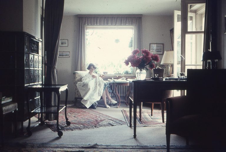 a woman sitting on a couch in a living room