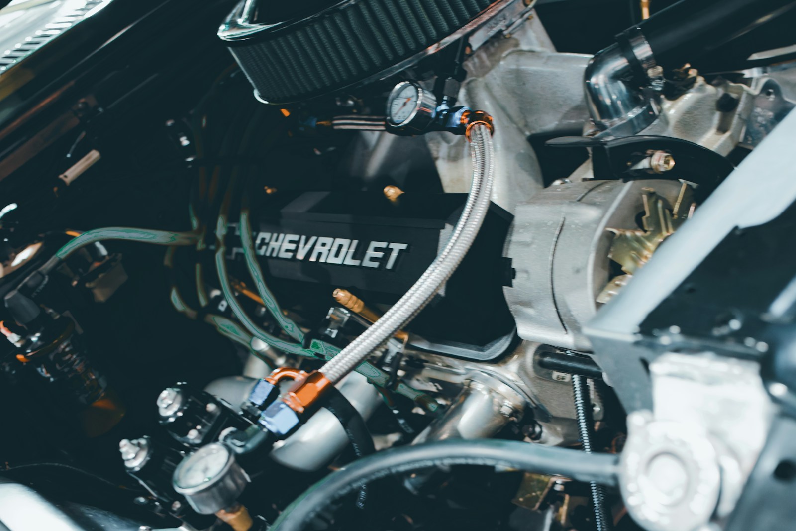 Close-up of a chevrolet engine with many parts.