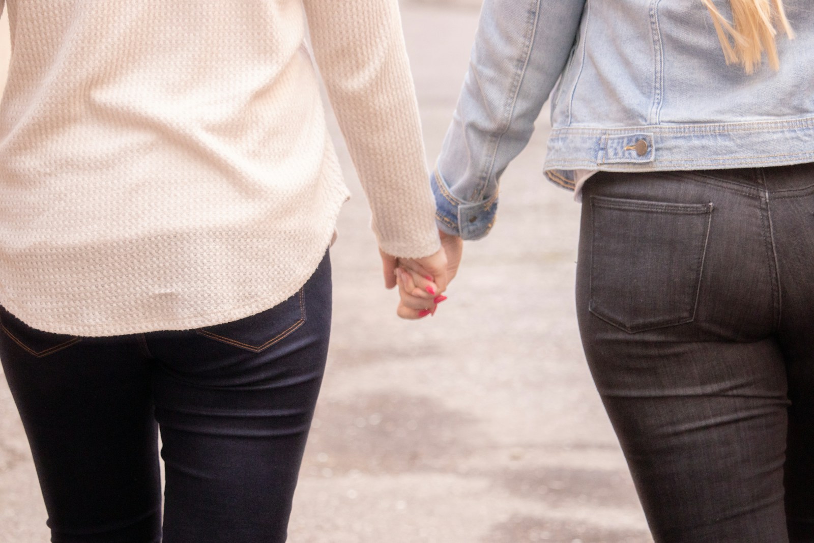 woman in white long sleeve shirt and black denim jeans