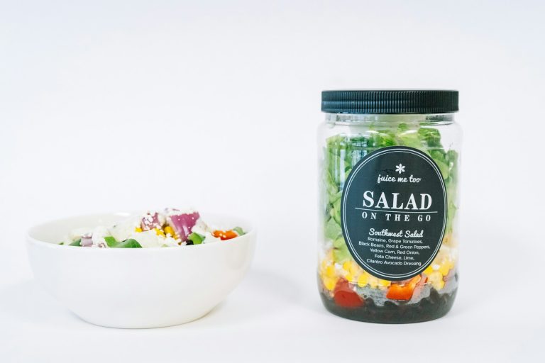 A salad-in-a-jar and a bowl of salad.