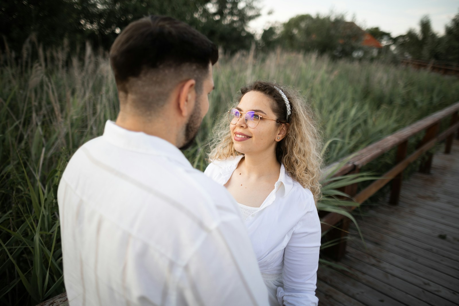 A couple gazes at each other lovingly.