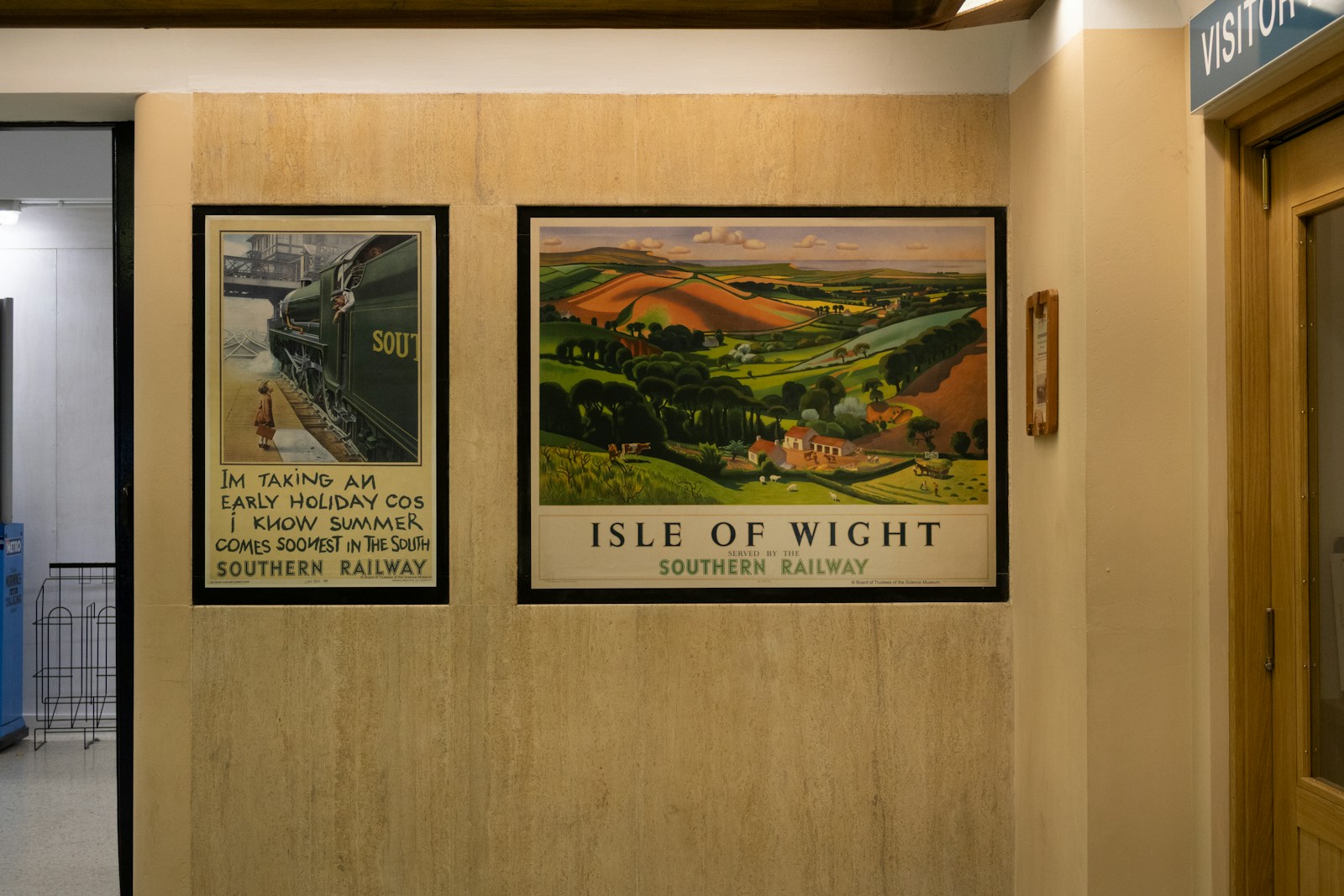 Two vintage travel posters on a wall