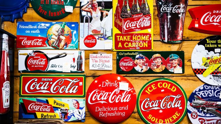 assorted Coca Cola sticker lot on wall