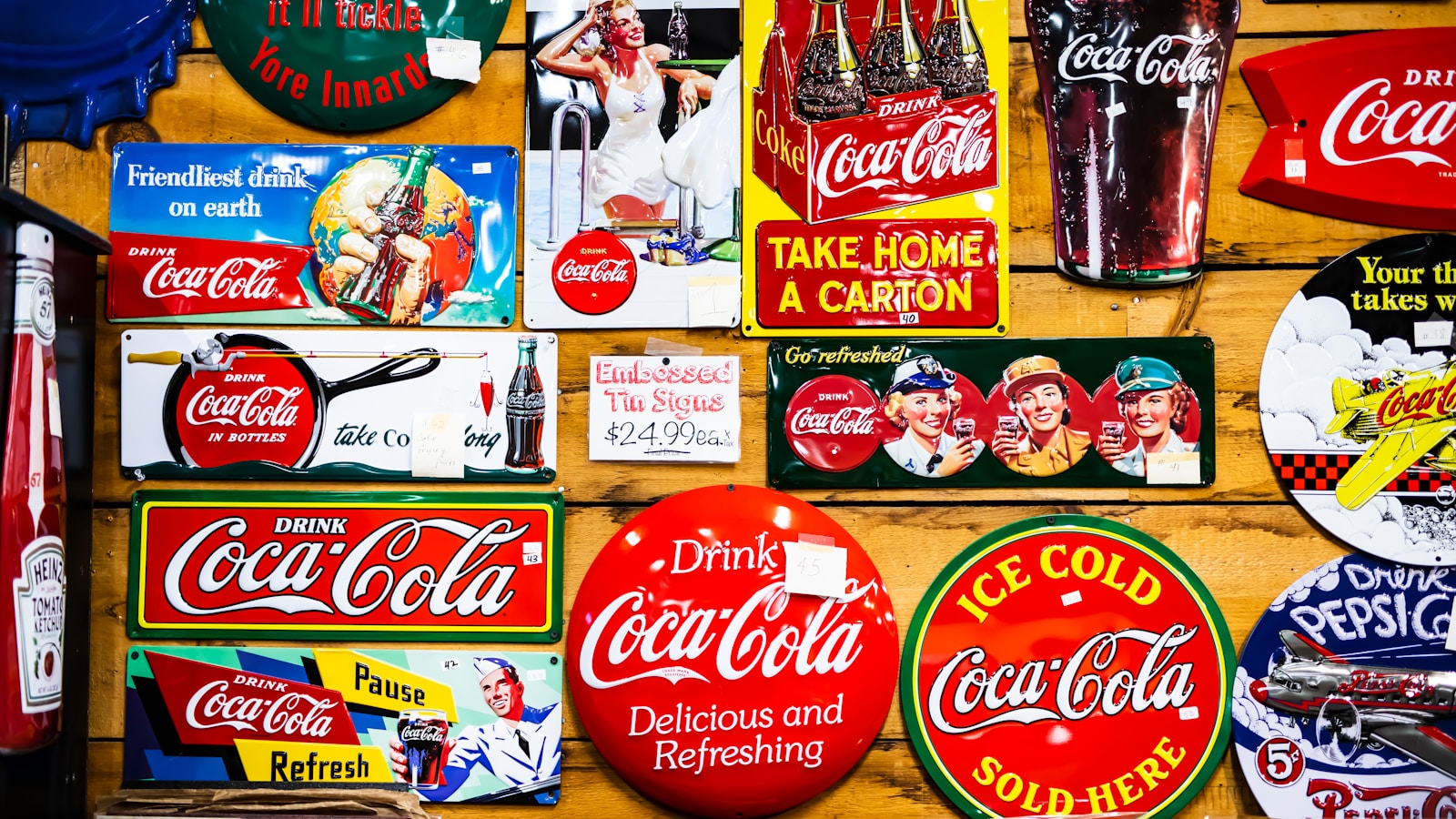 assorted Coca Cola sticker lot on wall