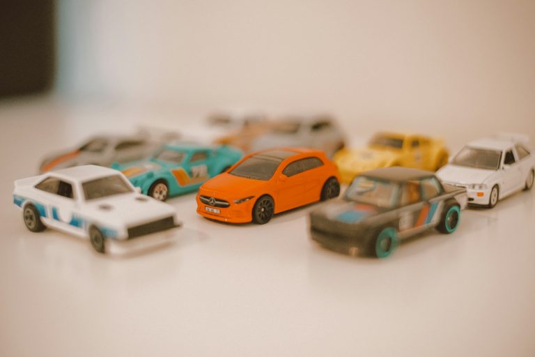 a group of toy cars sitting on top of a table