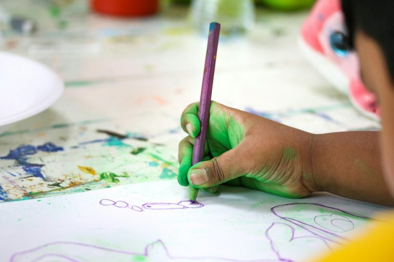 a child drawing on a paper