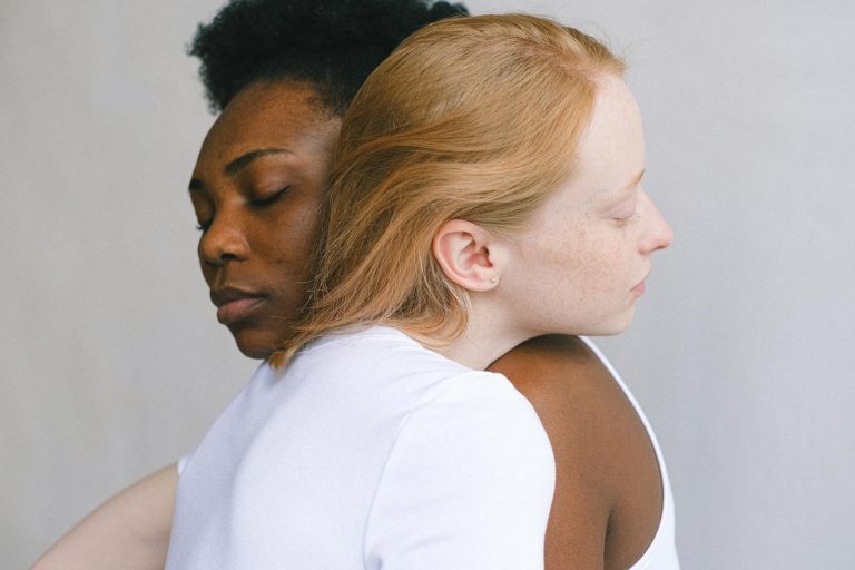 Tender embrace between an interracial couple showcasing love and connection.