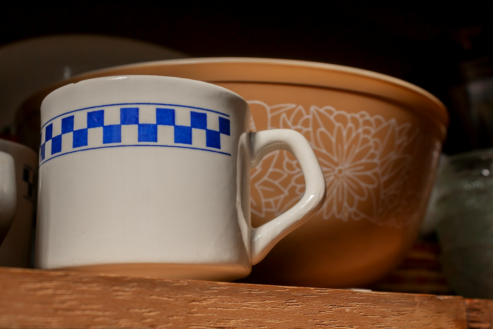 A couple of cups sitting on top of a wooden table