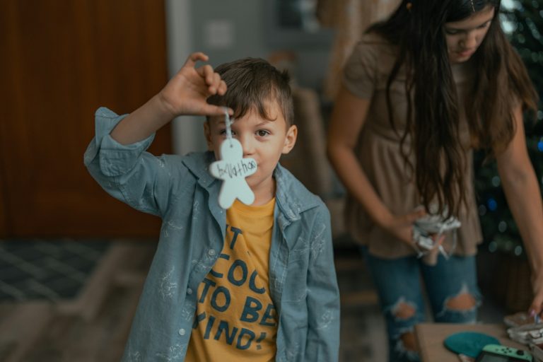 a boy with a toothbrush in his mouth