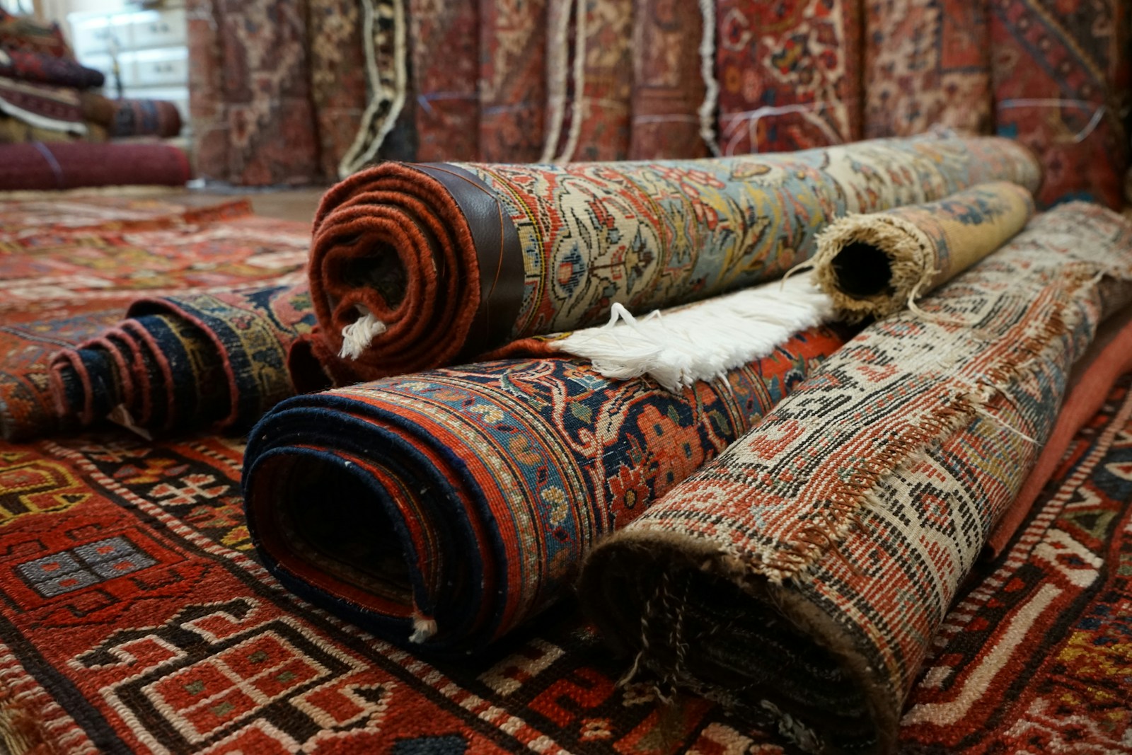 a pile of rugs laying on top of each other