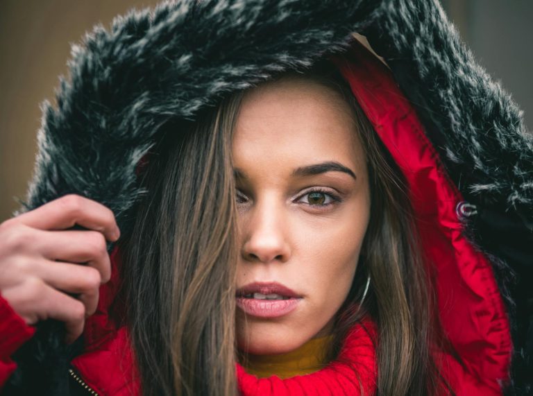 Close-up portrait of a woman in a fur hooded coat during winter in Reghin, Romania.