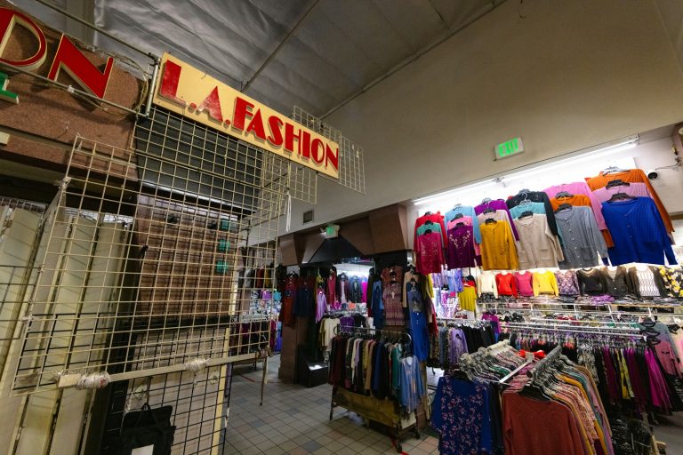 A clothing store displays colorful apparel.