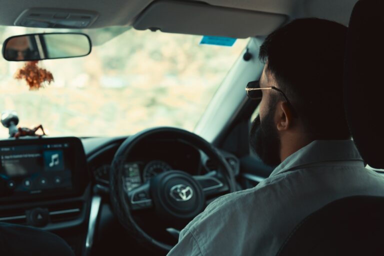 Man driving a car on a road