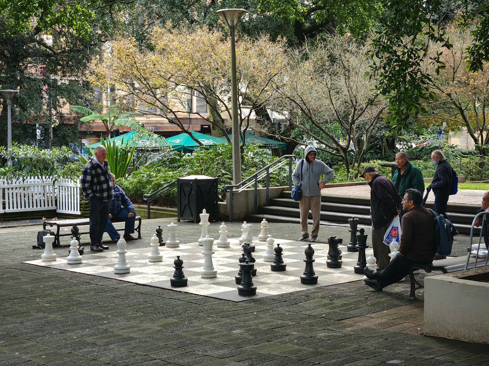 A group of people playing a game of chess