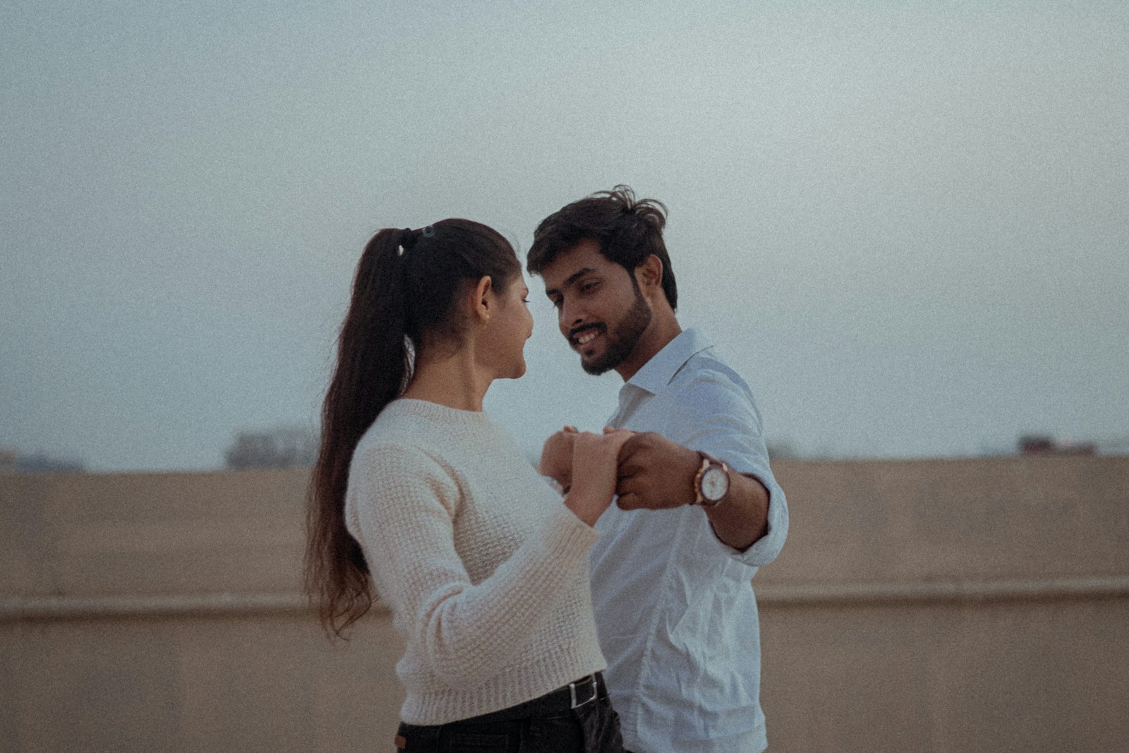 a man and a woman standing next to each other