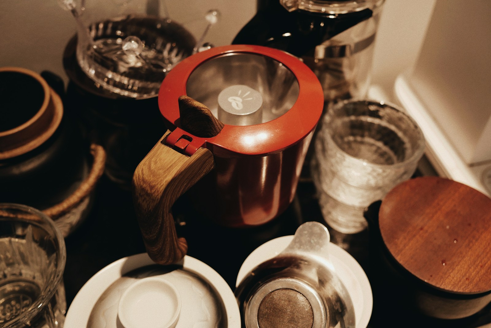 A table topped with lots of dishes and cups