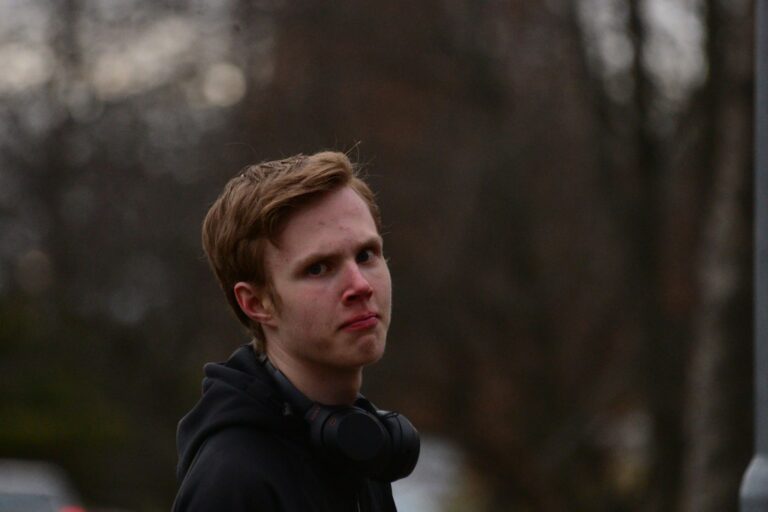 boy in black hoodie looking up