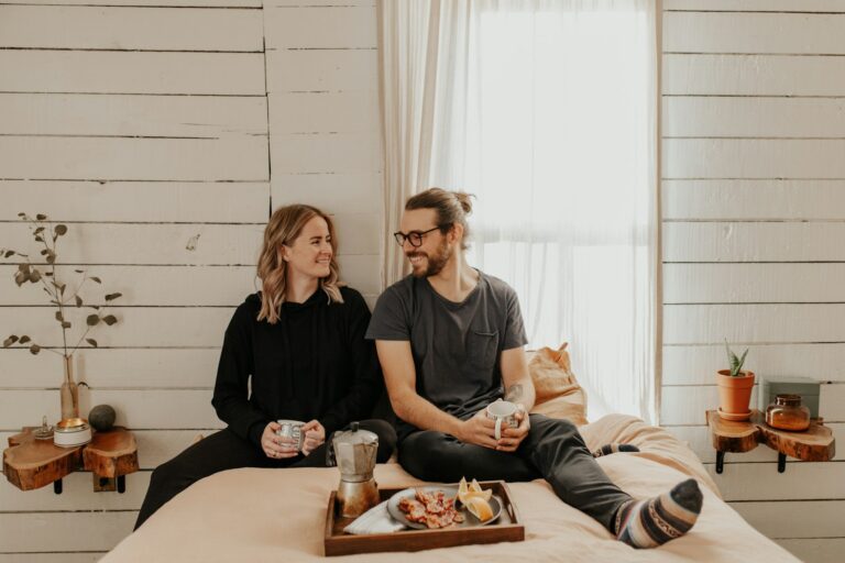 woman in black crew neck t-shirt sitting beside woman in black crew neck t-shirt