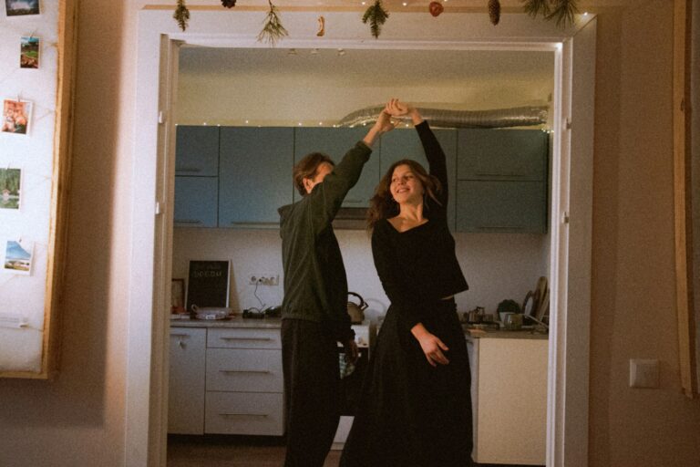 Couple dancing in a kitchen doorway