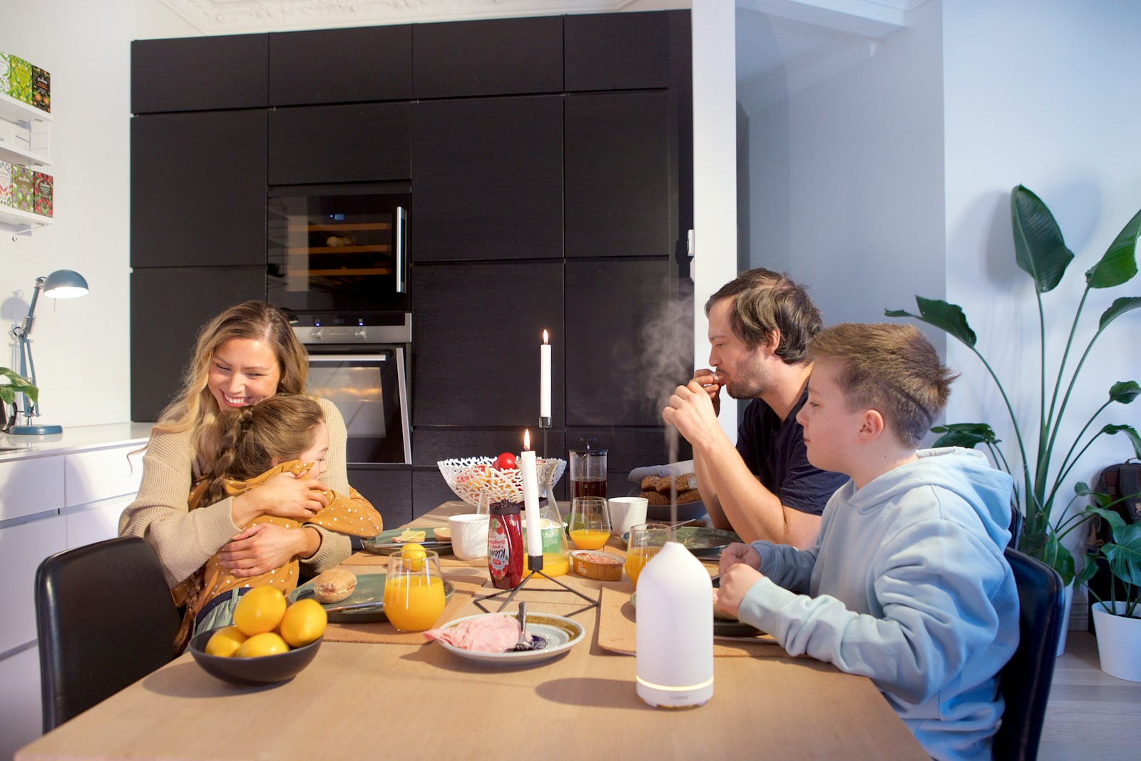 a group of people sitting around a table eating food