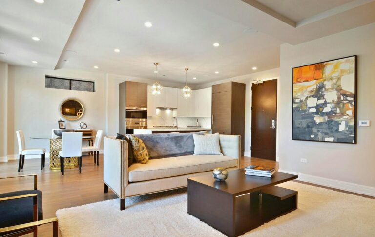 Modern, stylish living room with open concept kitchen.