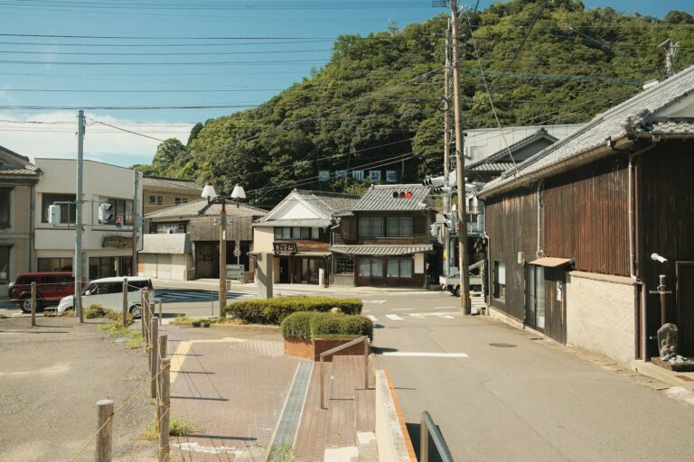 A row of buildings sitting on the side of a road