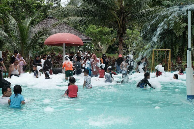 a group of people playing in a water park