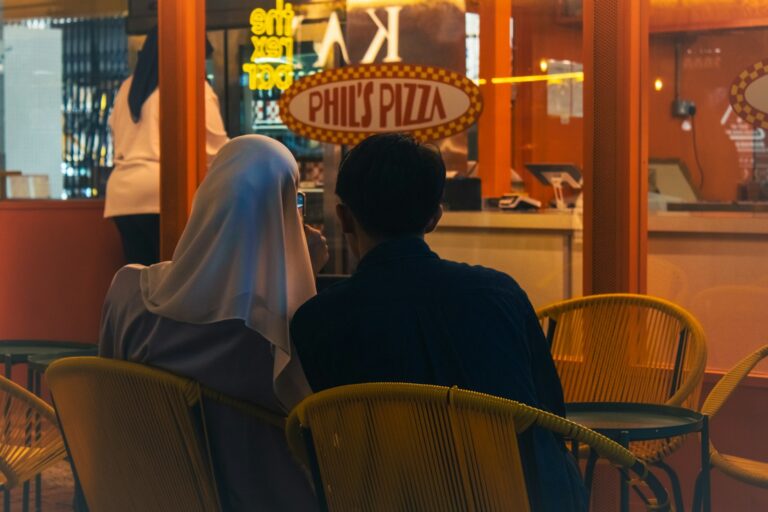 Two people sitting at a table in a restaurant