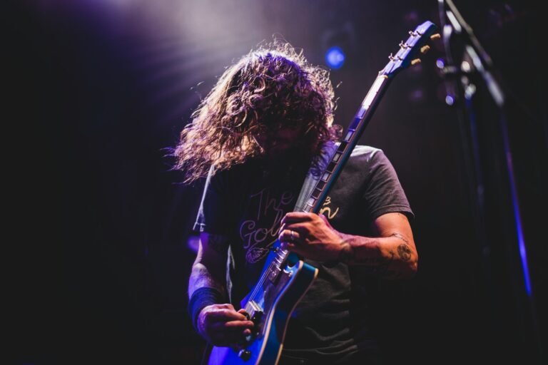 man playing electric guitar