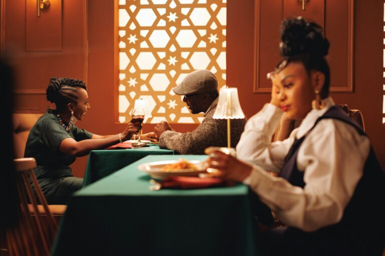 People are dining at a restaurant with elegant decor.