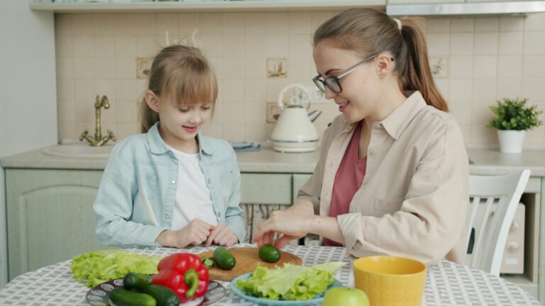 Mother and daughter preparing food in the kitchen.